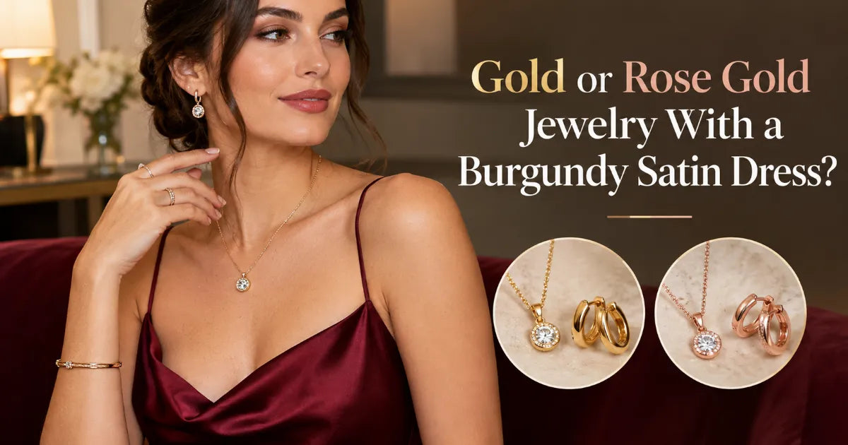 Wine red satin halter midi dress with draped cowl neck worn with brushed yellow gold drop earrings