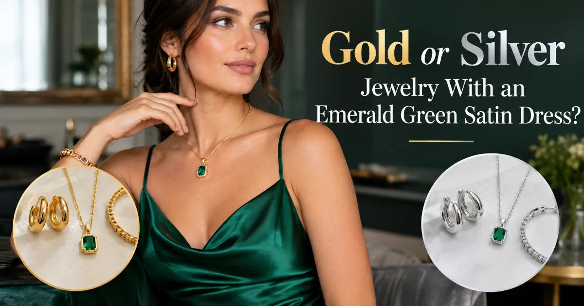 Emerald green satin mini dress with bishop sleeves worn with brushed gold drop earrings and silver rings