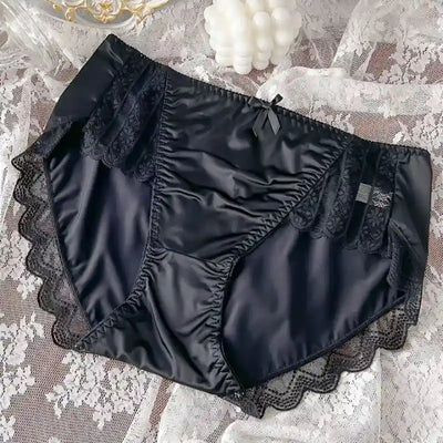 Black satin panties with matching black lace panels, scalloped edges, and satin bow detail
