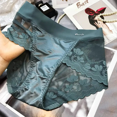 Teal satin and floral lace panel panties held in hand showing front detail