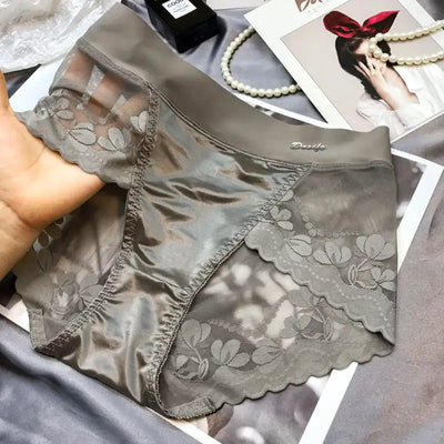 Gray floral lace panel panties held in hand showing front and side panels
