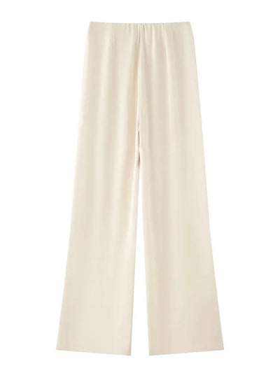 Cream wide-leg satin pants flat lay, slightly warmer ivory tone, front view on white background