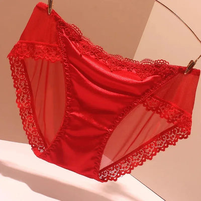 Red satin panties with red lace trim and sheer mesh panel details