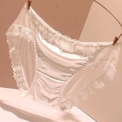 White satin panties with white embroidered lace trim and ruffle edges