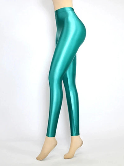 Second side view of glossy high-rise emerald green tapered satin pants on mannequin