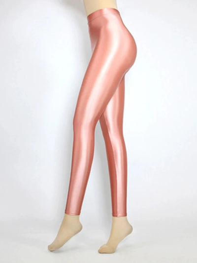 Side view of glossy high-rise blush pink tapered satin pants on mannequin