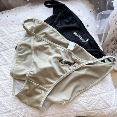 Sage green and black satin low-rise bikini briefs with oh honey embroidery flat lay