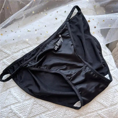 Single black low-rise satin bikini brief with white embroidered oh honey script front