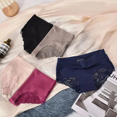 Five lace side panel satin panties in black, taupe, blush, rose red, and navy flat lay