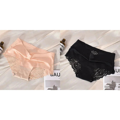 Blush pink and black mid-rise lace panel satin panties side by side on white bedding