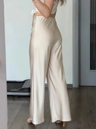 Champagne flared high-waist satin pants rear view showing clean back panel