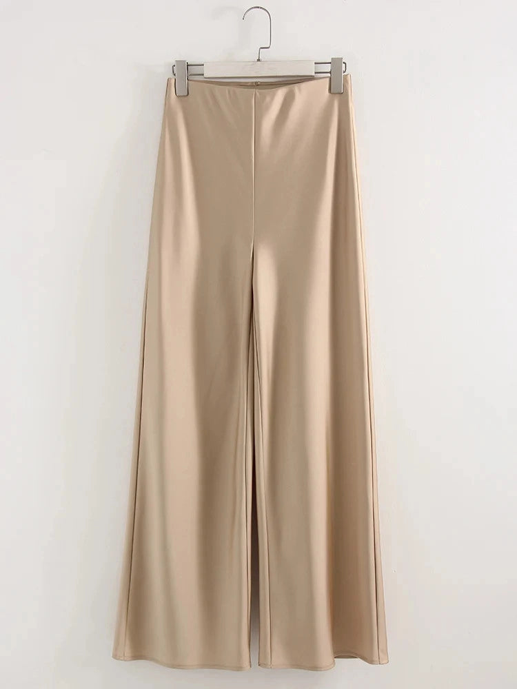 Champagne wide-leg satin pants with center-front seam, floor-length, displayed flat on a hanger