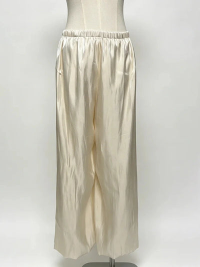 Ivory wide-leg satin pants with lace-panel elastic waistband shown on a dress form, front view