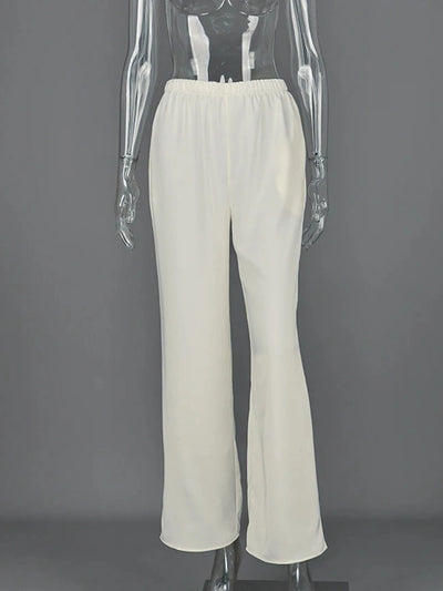 Off-white elastic-waist straight-leg satin pants displayed on a mannequin against a gray background
