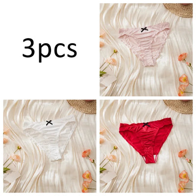Three-pack satin ruched panties in light pink, white, and red individual flat lay shots on cream background