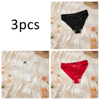 Three-pack satin ruched panties in black, white, and red individual flat lay shots on cream background