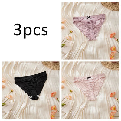 Three-pack satin ruched panties in lavender, black, and light pink individual flat lay shots on cream background