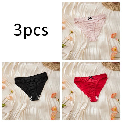 Three-pack satin ruched panties in light pink, black, and red individual flat lay shots on cream background