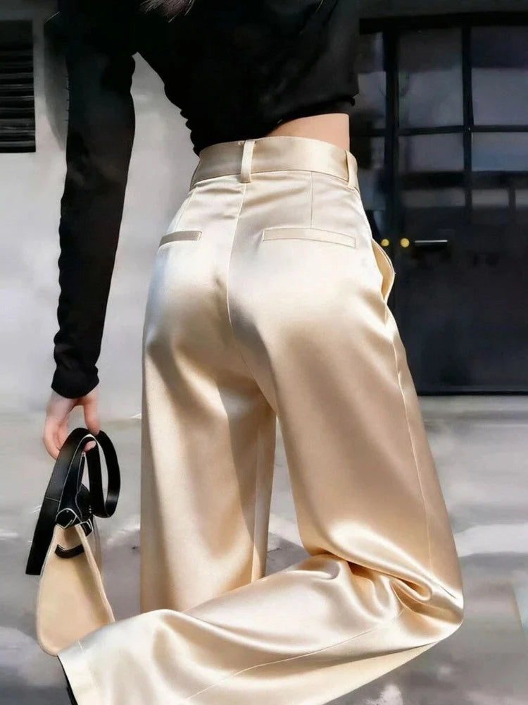 Champagne high-shine wide-leg satin pants with high-rise waist and back welt pockets