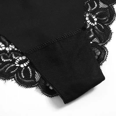 Close-up of overlock stitching and folded waistband detail on black lace-trim panty