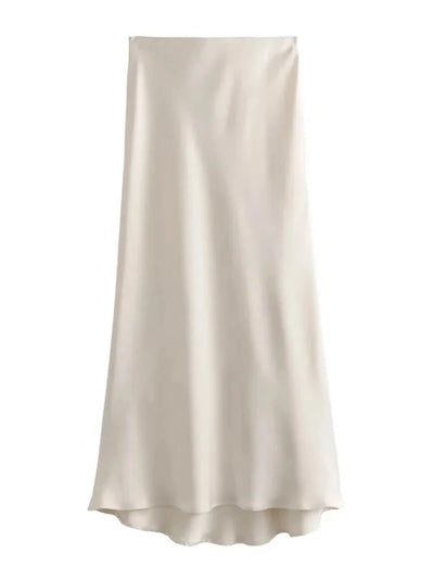 Ivory satin bias-cut midi skirt flat lay on white background with asymmetric hem detail