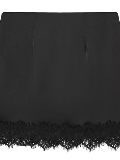 Flat lay of black satin mini skirt with scalloped floral lace trim along the hem