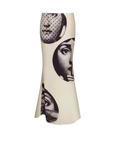 Flat lay of ivory mermaid satin skirt showing three oversized Fornasetti-inspired portrait medallions