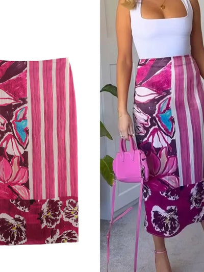 Front and styled view of a pink mixed-print midi skirt worn with a white cami and pink bag