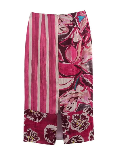 Back view of a pink floral stripe midi skirt showing front slit and full-length silhouette