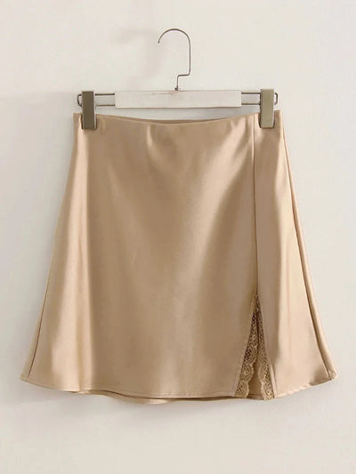 Champagne satin mini skirt with matching lace-trimmed front split hanging on silver clip hanger against white background