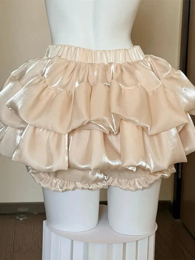 Champagne glossy tiered ruffle bubble skirt with bloomer bottom displayed on mannequin