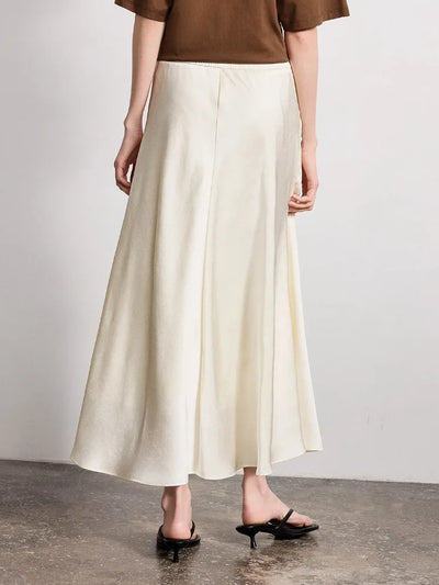 Back view of ivory crinkled satin midi skirt showing concealed zip and flared hem