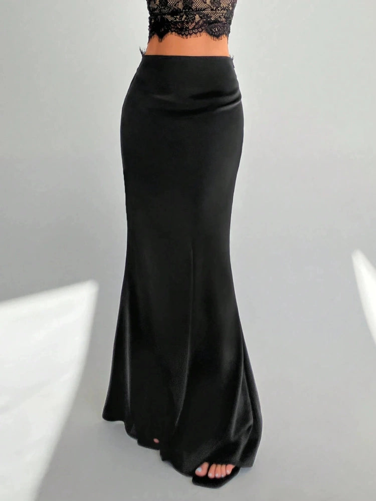 Front view of a black mermaid-cut maxi satin skirt with a flat waistband and flared floor-length hem