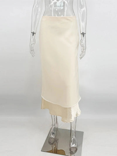 Flat display of champagne sheer overlay midi skirt showing layered organza and satin hem detail