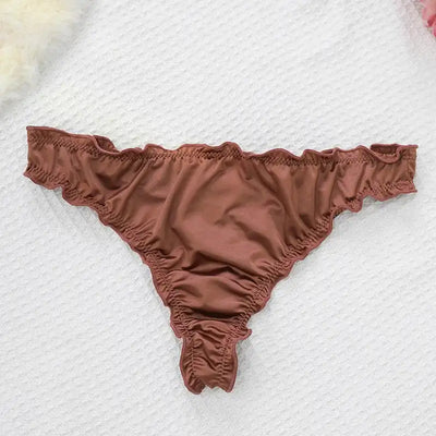 Single chocolate brown satin thong with ruffled edges on white textured background