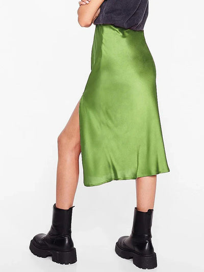 Side view of olive green satin midi skirt showing the side slit and fluid drape