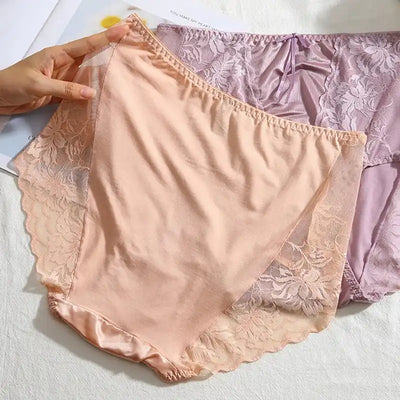 Peach and lavender satin panties with floral lace trim shown flat on white surface