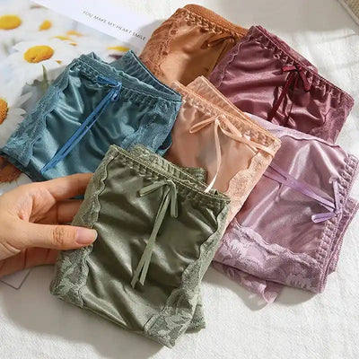 Six folded satin panties in multiple colors including teal, green, peach, and purple
