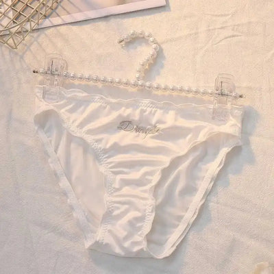 White ruched satin Dimple panties clipped to pearl hanger against white background