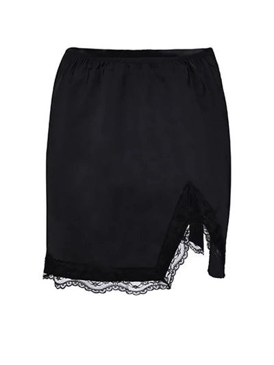 Flat lay of a black satin mini skirt showing elastic waist, front split, and scalloped lace hem detail