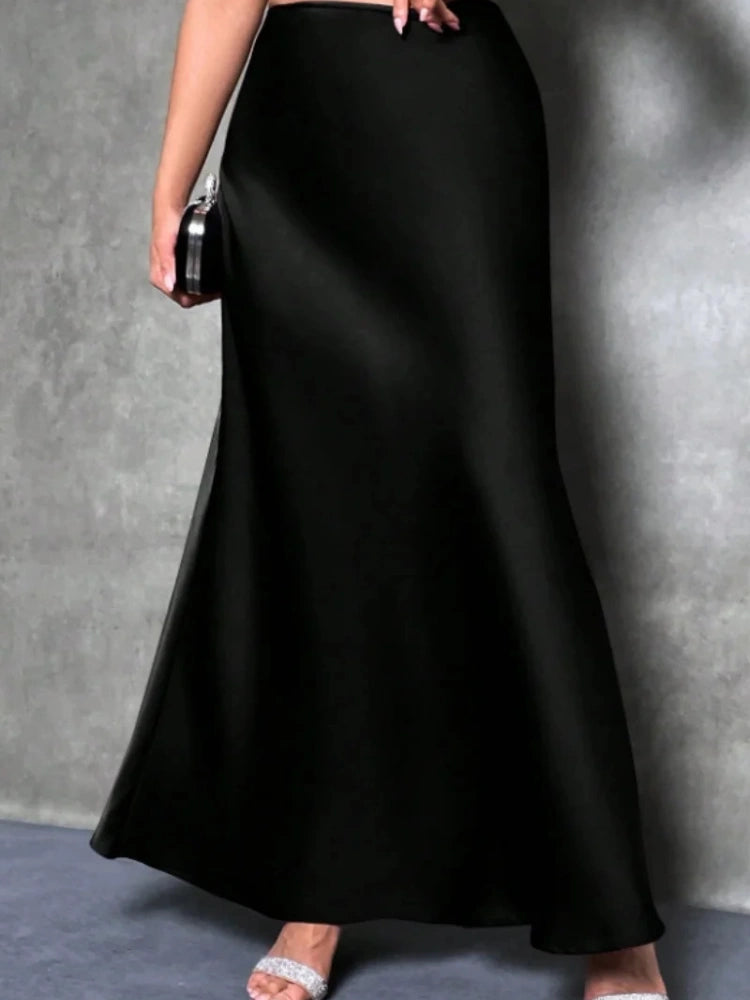 Black high-waist satin A-line maxi skirt with glossy finish and floor-length hem