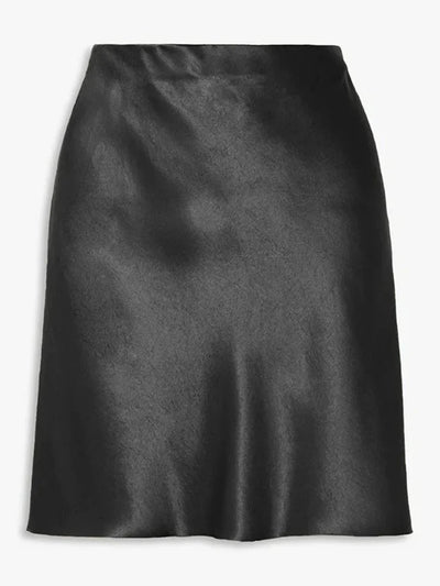 Flat lay of black satin A-line mini skirt showing glossy finish and fluted hem