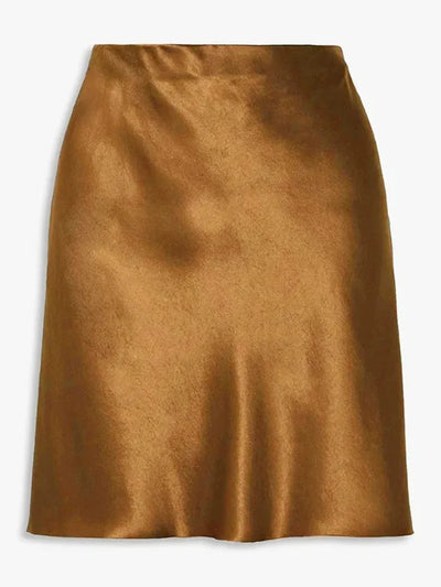 Flat lay of a golden satin flared mini skirt showing glossy finish and flared hem