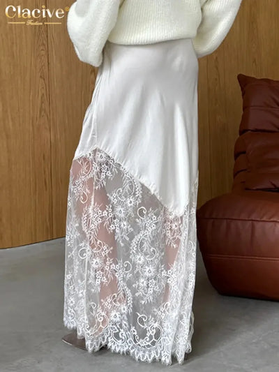 Back view of white satin maxi skirt with diagonal floral lace hem panel