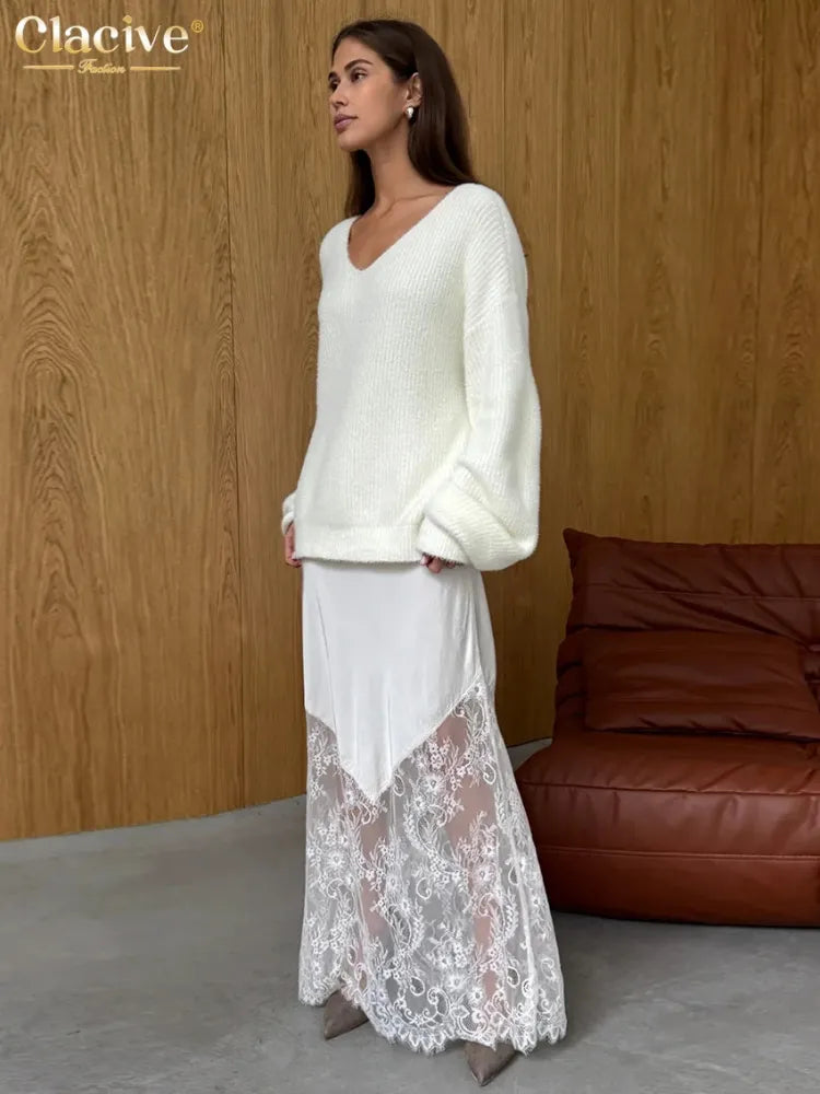 Back view of white satin maxi skirt with diagonal floral lace hem panel