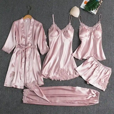 Pink satin five-piece pajama set with lace trim robe nightdress cami shorts and pants flat lay