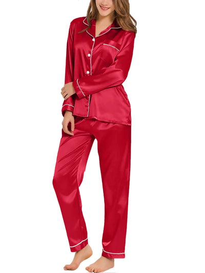 Woman wearing red satin long sleeve button-down pajama set with white contrast piping