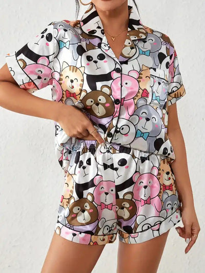 Standing front view of full cartoon animal print pajama set with elastic waistband shorts