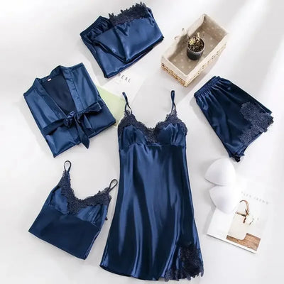 Navy satin five-piece pajama set with tonal floral lace trim flat lay