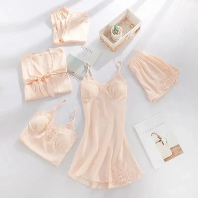 Champagne satin five-piece pajama set with floral lace slip dress and robe flat lay